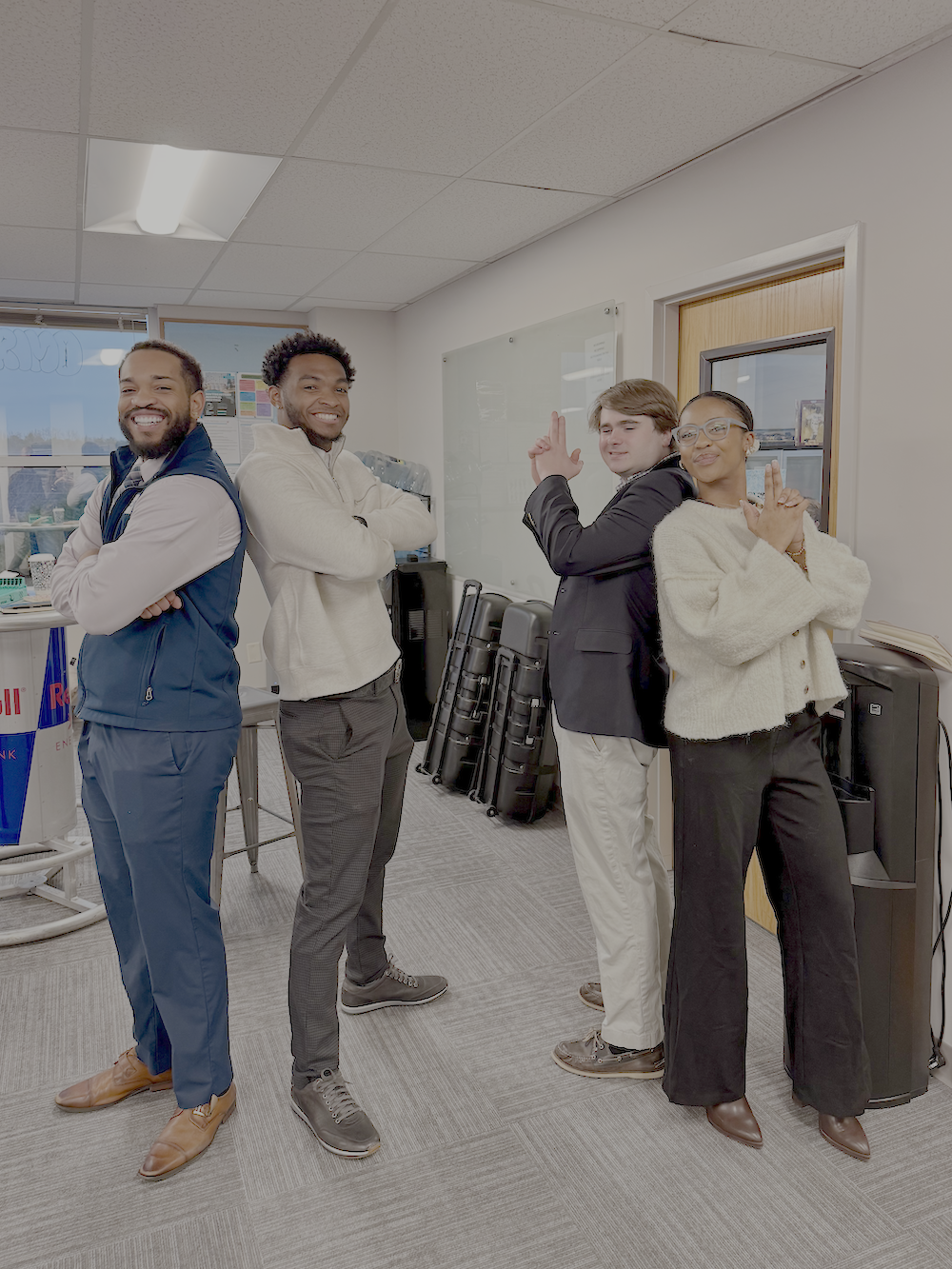 KULO team members posing and having fun in the office